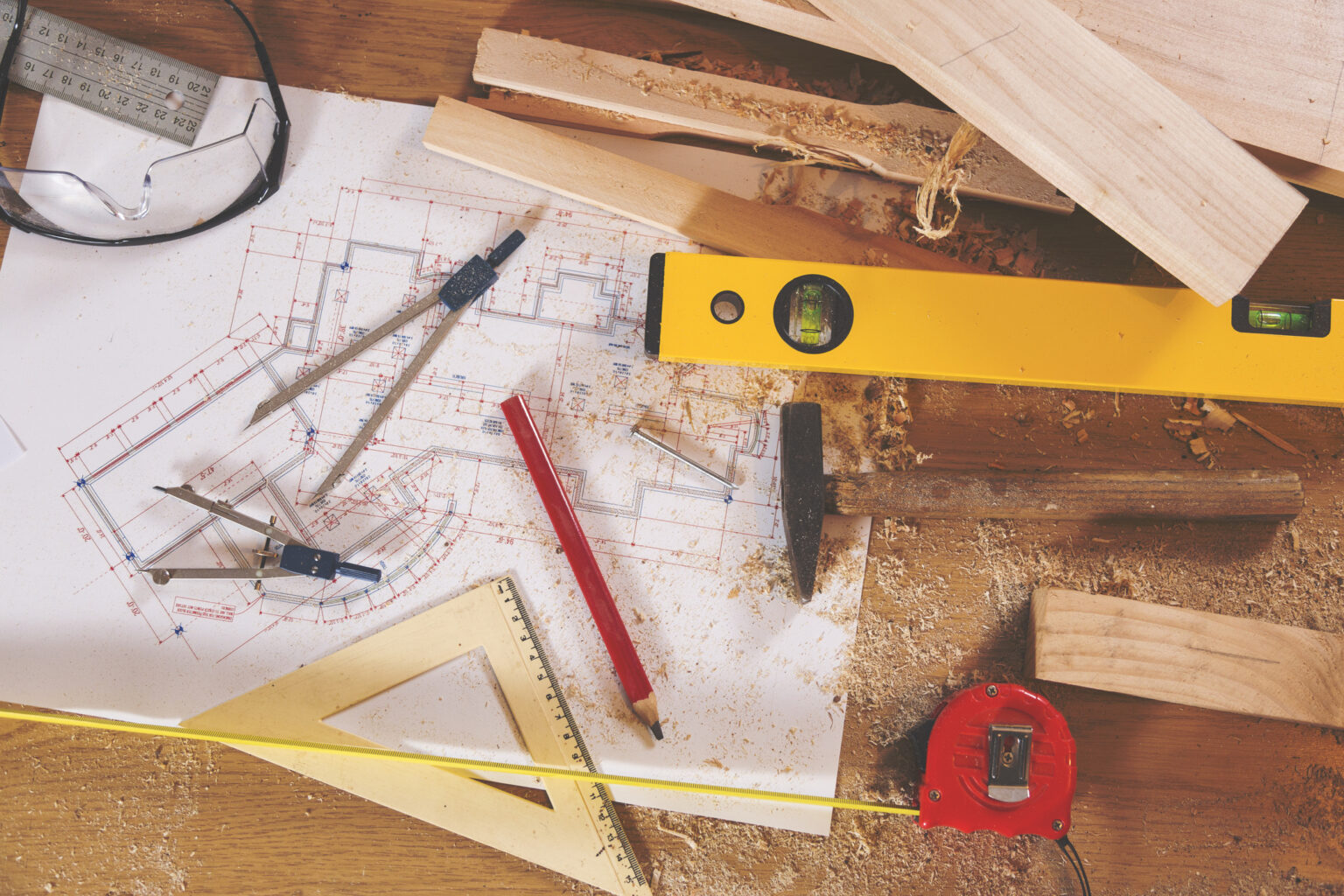 Carpenter tools on wooden background