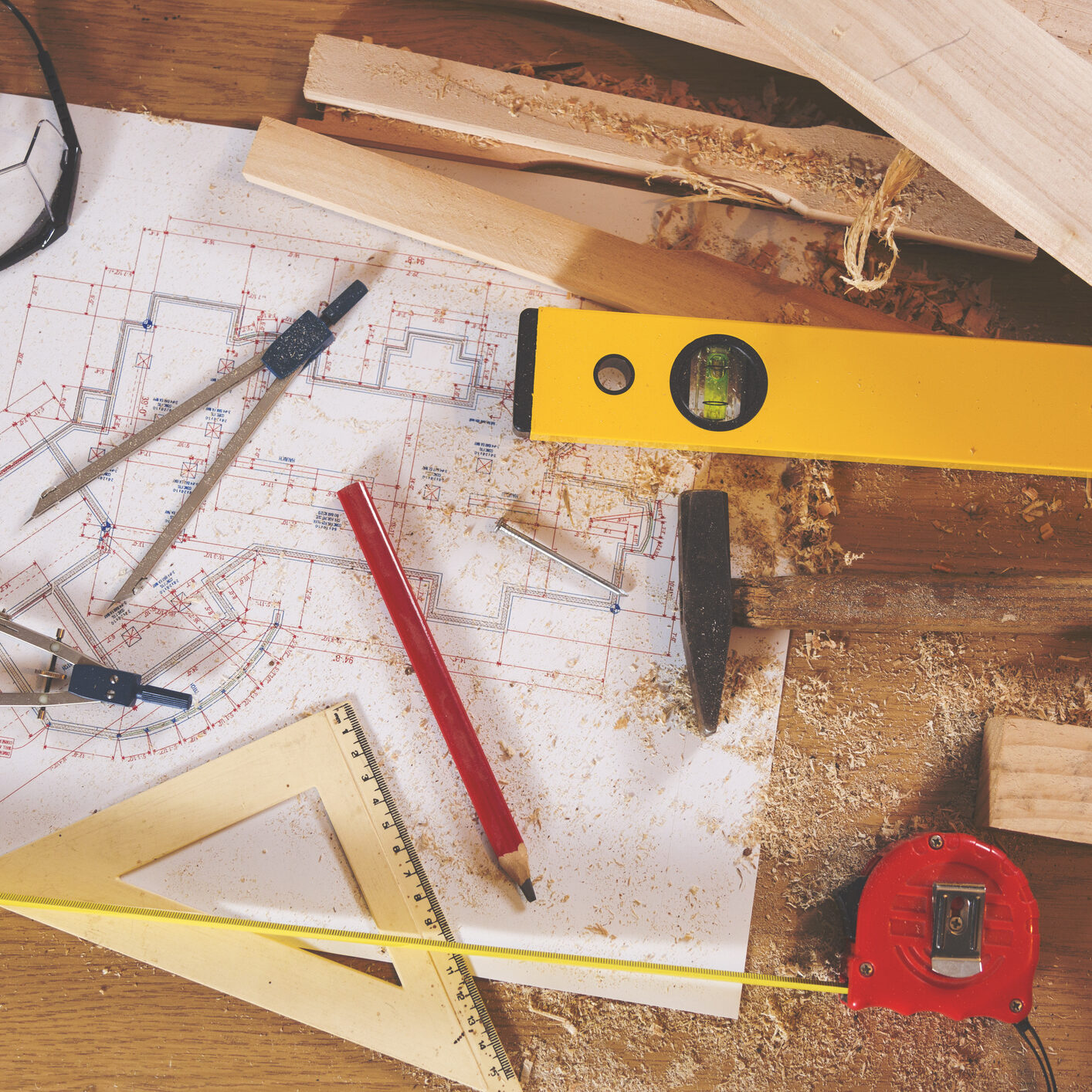 Carpenter tools on wooden background